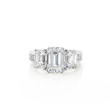 18CT WHITE GOLD THREE STONE EMERALD CUT RING WITH DIAMOND SET BAND