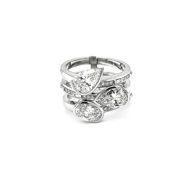 18CT WHITE GOLD PEARSHAPE, OVAL, BAGUETTE AND ROUND BRILLIANT CUT DIAMOND RING