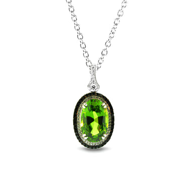 18CT WHITE GOLD, GREEN PERIDOT PENDANT WITH BLACK AND WHITE DIAMONDS