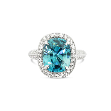 18CT WHITE GOLD OVAL BLUE ZIRCON AND DIAMOND RING