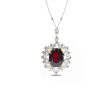 18CT WHITE AND YELLOW GOLD OVAL RUBY AND DIAMOND CLUSTER PENDANT
